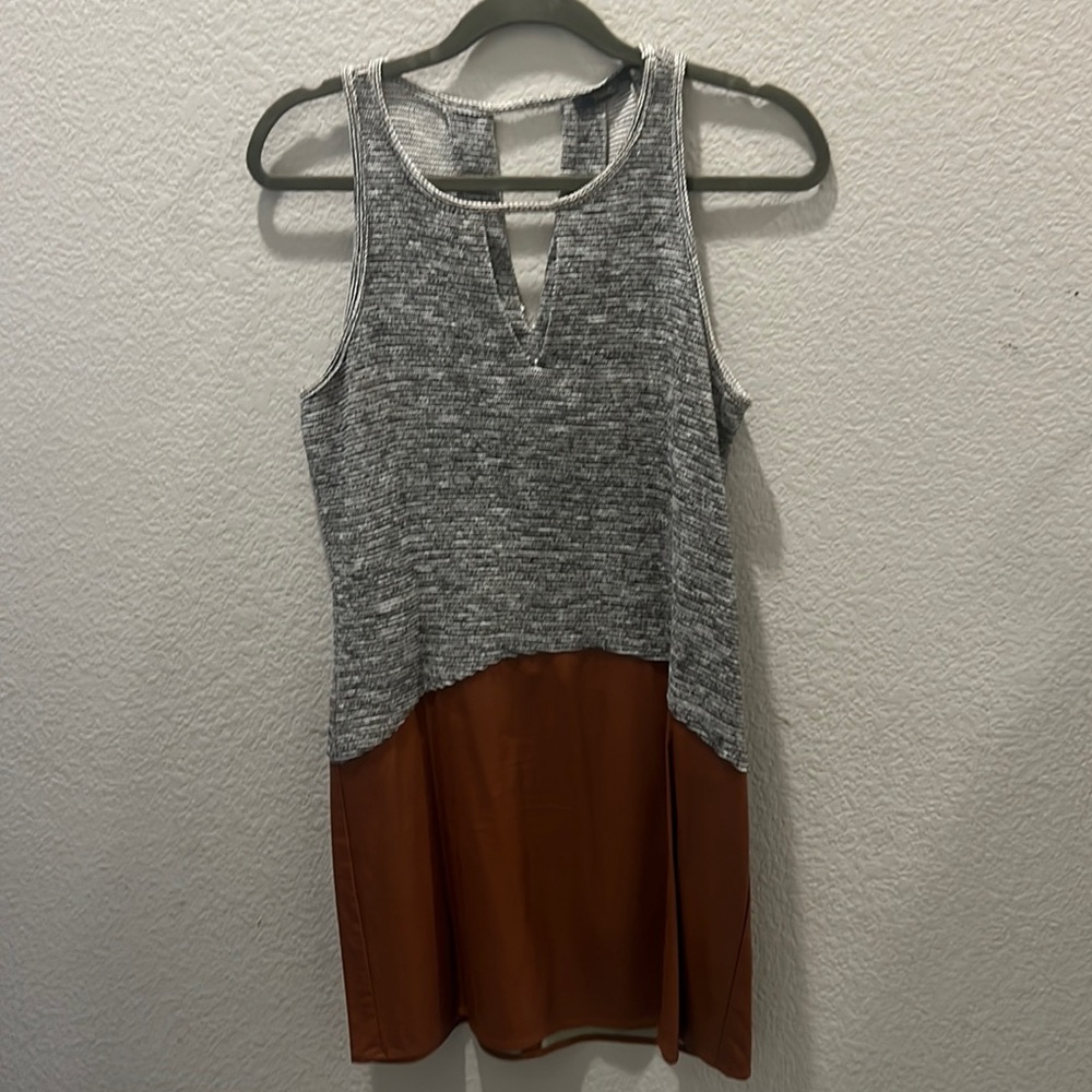 Tank top dress with leather that’s never been worn. Tag fell off.